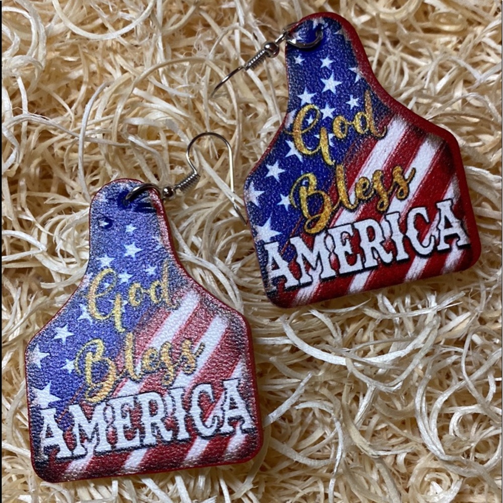 God bless America cow tag earrings
